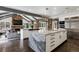 Spacious kitchen features a center island, stone accents, and a cozy living area with a fireplace nearby at 4475 S Downing St, Cherry Hills Village, CO 80113