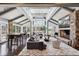 Spacious living room featuring a fireplace, high ceilings, and lots of natural light at 4475 S Downing St, Cherry Hills Village, CO 80113