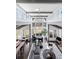 Spacious living room with high ceilings, large windows, modern furniture, and elegant chandelier at 4475 S Downing St, Cherry Hills Village, CO 80113