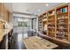 Spacious office with built-in bookshelves and workstations, offering plenty of room for studying and working from home at 4475 S Downing St, Cherry Hills Village, CO 80113