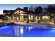 Backyard with a pool, fireplace, covered patio, bar area, and a beautiful landscape at 4475 S Downing St, Cherry Hills Village, CO 80113