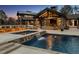 A stunning pool with a cascading waterfall adds a touch of luxury to the outdoor space at 4475 S Downing St, Cherry Hills Village, CO 80113