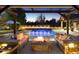 Backyard pool and lounging area with outdoor seating, a fire pit, and a covered patio at 4475 S Downing St, Cherry Hills Village, CO 80113