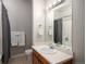 Bathroom featuring a shower with tub and a stylish single sink vanity and neutral colors at 277 N Broadway # 403, Denver, CO 80203