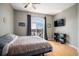 Cozy bedroom with hardwood floors, arched windows, and modern furnishings for relaxation at 277 N Broadway # 403, Denver, CO 80203
