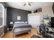 Comfortable bedroom with modern decor, hardwood flooring, and ample natural light at 277 N Broadway # 403, Denver, CO 80203