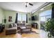 Bright living room with large windows, hardwood floors, and comfortable seating arrangement at 277 N Broadway # 403, Denver, CO 80203