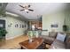 Inviting living area featuring hardwood floors, breakfast bar, and comfortable brown sectional at 277 N Broadway # 403, Denver, CO 80203