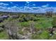 Scenic backyard view with mature trees, green space, and glimpses of a distant mountain range at 22388 Quail Run Dr, Parker, CO 80138