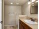 Bathroom featuring vanity with sink, mirror, and tiled shower at 22388 Quail Run Dr, Parker, CO 80138
