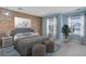 Inviting bedroom with wood accent wall and natural light at 22388 Quail Run Dr, Parker, CO 80138