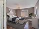 Comfortable bedroom with hardwood floors, chandelier, and stylish decor at 22388 Quail Run Dr, Parker, CO 80138
