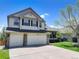 Charming two-story home with a three car garage, landscaped yard, and beautiful curb appeal at 22388 Quail Run Dr, Parker, CO 80138