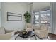 Stylish living room with high ceilings, large windows, and comfortable seating arrangement at 22388 Quail Run Dr, Parker, CO 80138