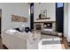 Inviting living room featuring a stone fireplace, comfortable seating, and stylish decor at 22388 Quail Run Dr, Parker, CO 80138