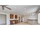 Spacious open-concept living area with bar, stainless steel appliances, and recessed lighting at 22388 Quail Run Dr, Parker, CO 80138
