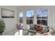 Bright living room with large windows, balcony access, and stylish decor at 22388 Quail Run Dr, Parker, CO 80138