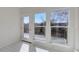 Bright sunroom with large windows and access to a deck, flooding the space with natural light at 22388 Quail Run Dr, Parker, CO 80138