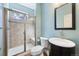 Bathroom featuring a glass-enclosed shower, toilet, and vanity with a sink at 3431 Fantasy Pl, Castle Rock, CO 80109
