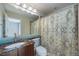 Updated bathroom featuring elegant tile work, a sink, toilet and a shower/tub at 3431 Fantasy Pl, Castle Rock, CO 80109