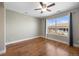 This bedroom features wood flooring, a ceiling fan, and neutral colored walls at 3431 Fantasy Pl, Castle Rock, CO 80109