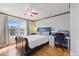Bedroom with natural light, wood flooring, and a desk for a workspace at 3431 Fantasy Pl, Castle Rock, CO 80109