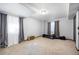 Spacious bedroom with neutral carpet and curtains, ideal for customization at 3431 Fantasy Pl, Castle Rock, CO 80109