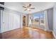 Bright bedroom with hardwood floors, fan, and large windows for natural light at 3431 Fantasy Pl, Castle Rock, CO 80109