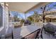 Inviting covered deck with outdoor dining and grill, perfect for entertaining at 3431 Fantasy Pl, Castle Rock, CO 80109