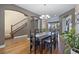 Cozy dining area with a chandelier and hardwood floors, perfect for enjoying meals with Gathering and friends at 3431 Fantasy Pl, Castle Rock, CO 80109