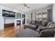 Inviting living room featuring a comfortable gray sectional, a fireplace, and sliding doors to the backyard at 3431 Fantasy Pl, Castle Rock, CO 80109