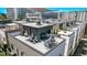 Aerial view of a rooftop deck with outdoor furniture and city views at 1333 Elati St # 1, Denver, CO 80204