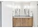 Bathroom with double vanity, modern lighting, and sleek mirrors, offering a spacious and bright design at 1333 Elati St # 1, Denver, CO 80204