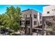 Modern townhome with sleek design, balcony, and landscaped surroundings at 1333 Elati St # 1, Denver, CO 80204