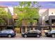 Modern exterior of a townhome with a landscaped front yard and street parking at 1333 Elati St # 1, Denver, CO 80204