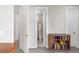 Hallway with a view into a bathroom, showing modern fixtures and a clean design at 1333 Elati St # 1, Denver, CO 80204