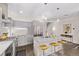 Contemporary kitchen featuring stainless steel appliances, an island with seating, and modern lighting at 1333 Elati St # 1, Denver, CO 80204