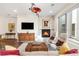 Bright living room featuring a fireplace, hardwood floors, and large windows with natural light at 1333 Elati St # 1, Denver, CO 80204