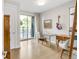 Bright office space featuring a glass desk, hardwood floors, and large windows with a balcony view at 1333 Elati St # 1, Denver, CO 80204