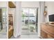 Balcony view with sliding glass doors, a storage shelf, and street views outside the window at 1333 Elati St # 1, Denver, CO 80204