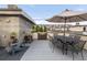 Outdoor rooftop deck with a barbecue grill, dining area, and city view at 1333 Elati St # 1, Denver, CO 80204