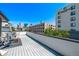 Rooftop deck overlooking the city with stylish outdoor furniture at 1333 Elati St # 1, Denver, CO 80204