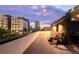 Stylish rooftop deck offering seating, grilling area, and panoramic views of the city skyline at 1333 Elati St # 1, Denver, CO 80204