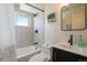 Updated bathroom with patterned tile and modern fixtures at 18932 W 60Th Dr, Golden, CO 80403