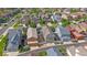 Neighborhood aerial view showcasing many homes with solar panels, and an adjacent undeveloped field at 21392 E Stroll Ave, Parker, CO 80138