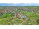 Aerial view features the community pool and clubhouse nestled in a well-maintained neighborhood at 21392 E Stroll Ave, Parker, CO 80138