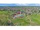 A luxurious community pool and clubhouse are the center pieces in this aerial view of this vibrant community at 21392 E Stroll Ave, Parker, CO 80138