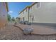 Large stone patio with a built in barbeque, basketball hoop, and rock landscaping at 21392 E Stroll Ave, Parker, CO 80138