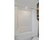 Bright bathroom with white tiled shower and tub combo at 21392 E Stroll Ave, Parker, CO 80138