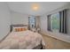 Cozy bedroom featuring a comfy bed, natural light from the windows, and neutral color palette at 21392 E Stroll Ave, Parker, CO 80138